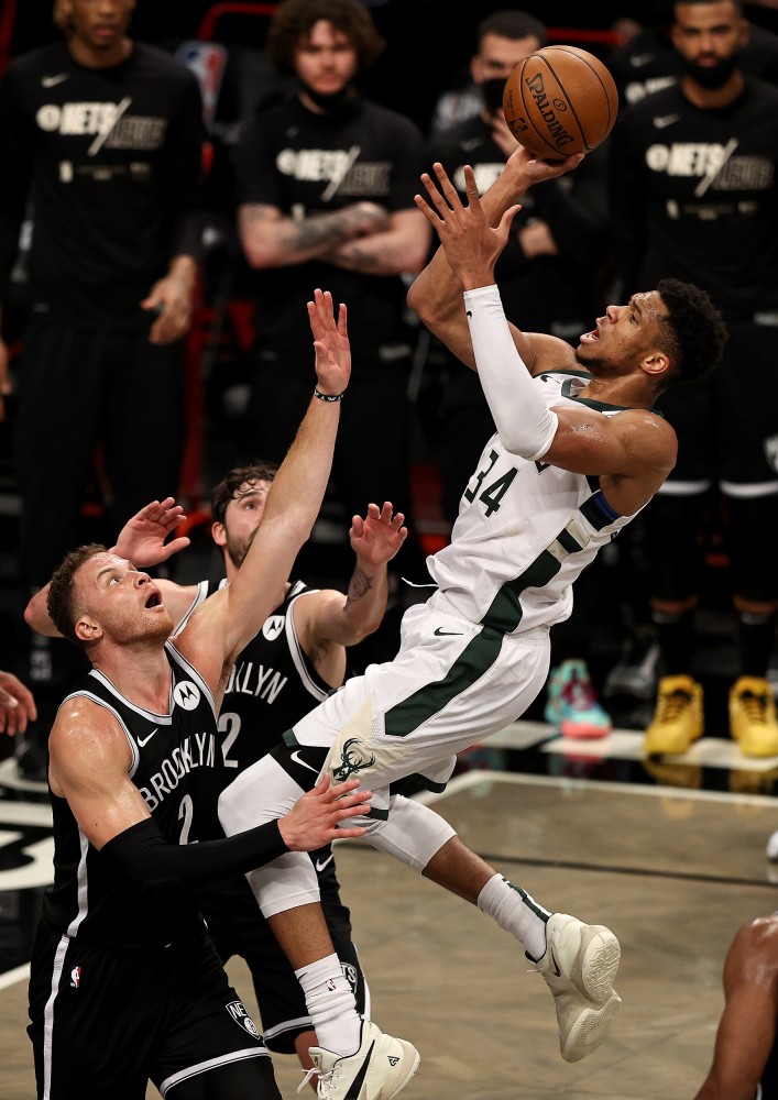  掘金队加时险胜雄鹿登顶西部  